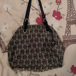 Michael Kors purse, tanish brown color in good condition